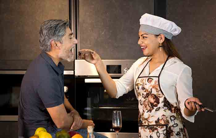 Woman cooking for him to keep him interested