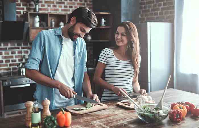 Couple cooking together is an example of couple activities.