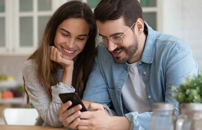 Couples looking at a phone together