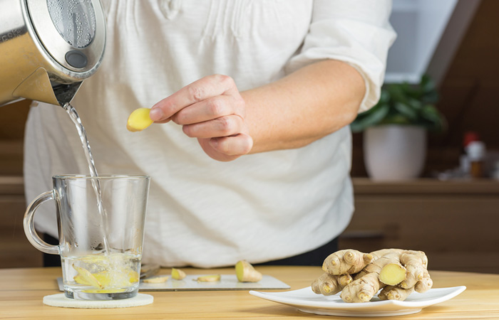 Woman preparing hot ginger water to maintain creatinine level