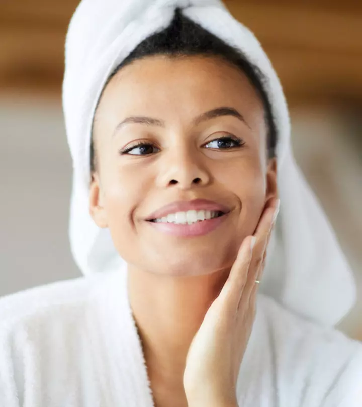 A girl applying polyhydroxy acids on her skin