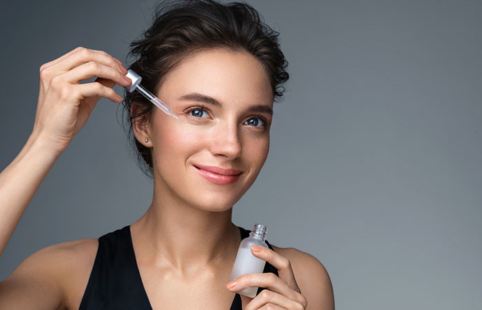 Woman applying argireline product to her skin