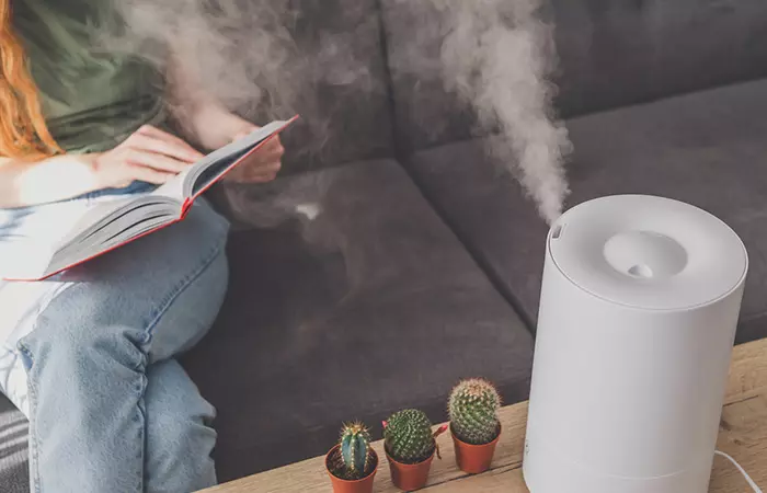 Woman using humidifier