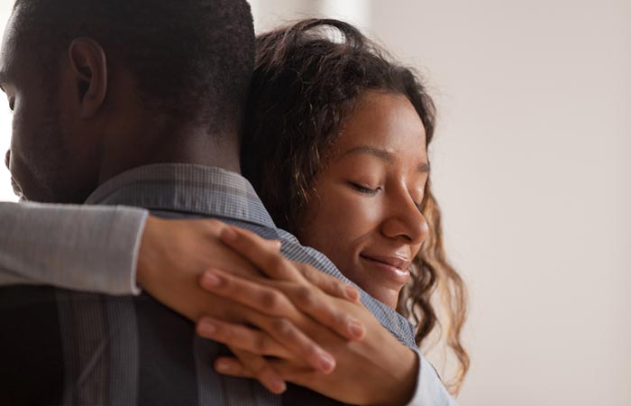 Woman embracing her ex husband as a sign of forgiveness