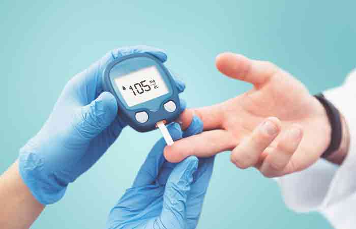 Doctor checkin patient's blood sugar level