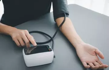 Woman checking blood pressure levels 