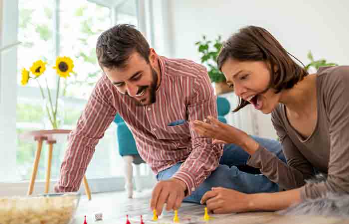 Couple playing ludo and enjoiying the activity 