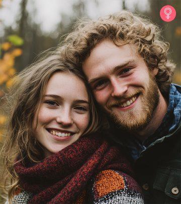 A guy holding his partner from behind