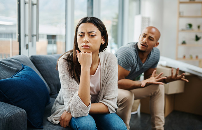 Woman refusing to talk to husband and turning away from him