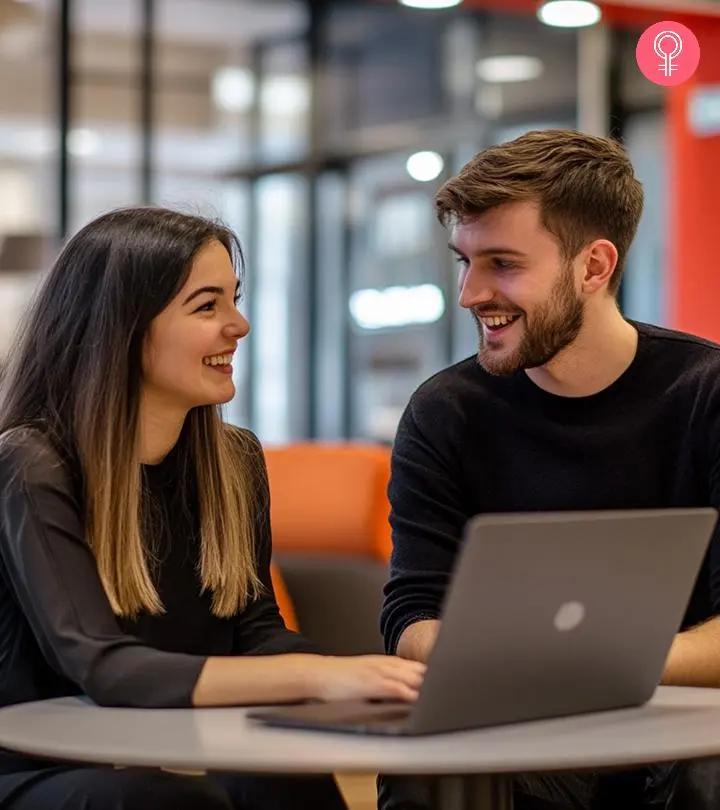 Boy and girl talking with each other in an office