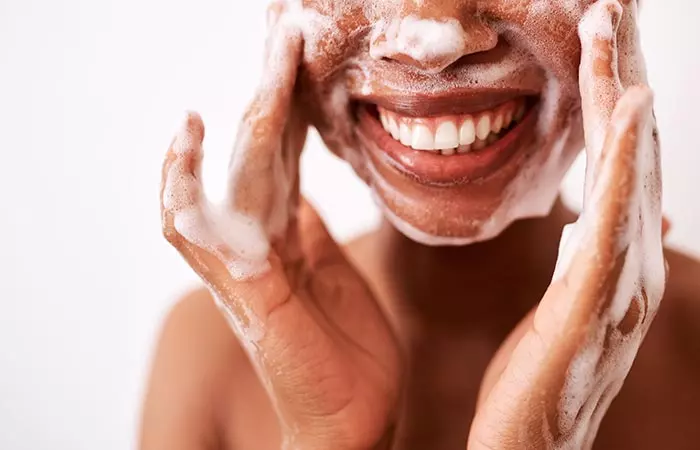 Woman washing her face