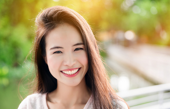 Smiling woman with porcelain skin