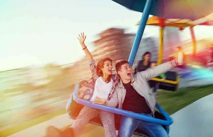 Couple having fun at an amusement park is one of the example of couple activities.