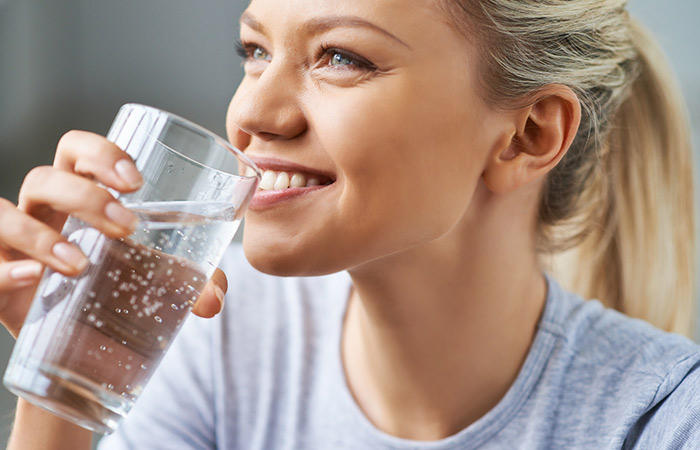 Woman drinking sparkling water
