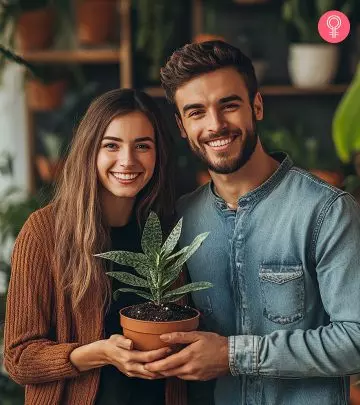 The best couple is holding a small tree plant