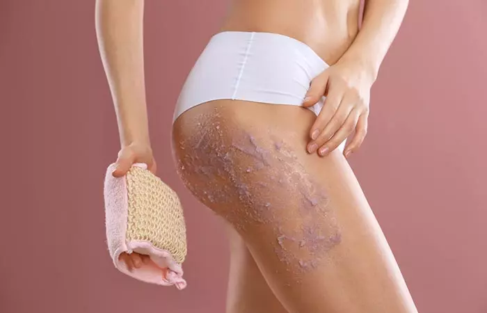 Exfoliate legs to get rid of stretch mark scars