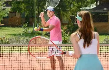 Couple playing tennis is one of the example of couple activities.