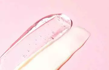 Transparent snail mucin on pink background
