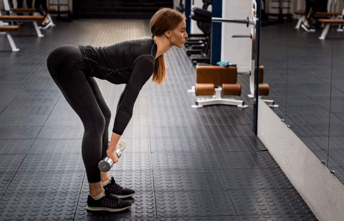 Young woman practicing Romanian deadlift