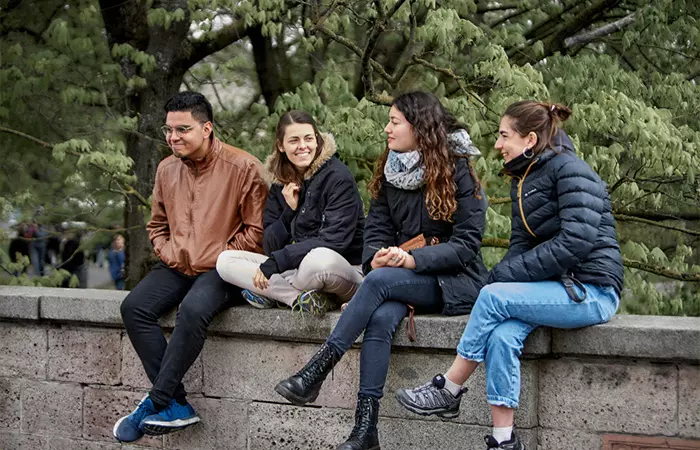 Campus friends engaged in conversation