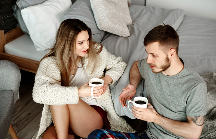 Couple asking deep relationship questions to each other over coffee