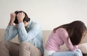 Couple stressed and angry at each other.