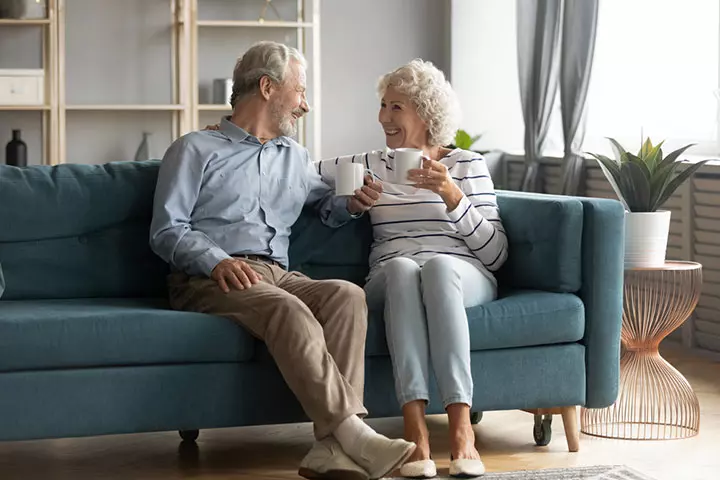 Elderly couple talking and laughing