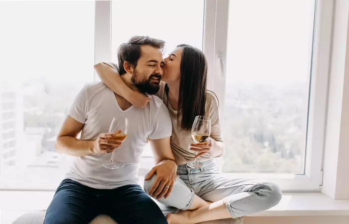  A young woman hugging and kissing her partner