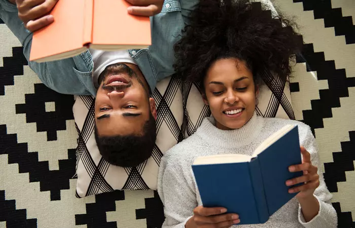 Reading a book is one of the things for couple to do at home