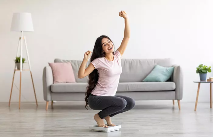 Woman celebrating her weight loss for purslane seeds