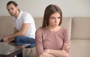 A stubborn Leo woman ignoring her partner
