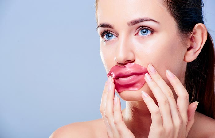 Woman using a lip mask to get healthy, soft, and moisturized lips