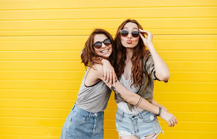 Two friends posing for a photograph