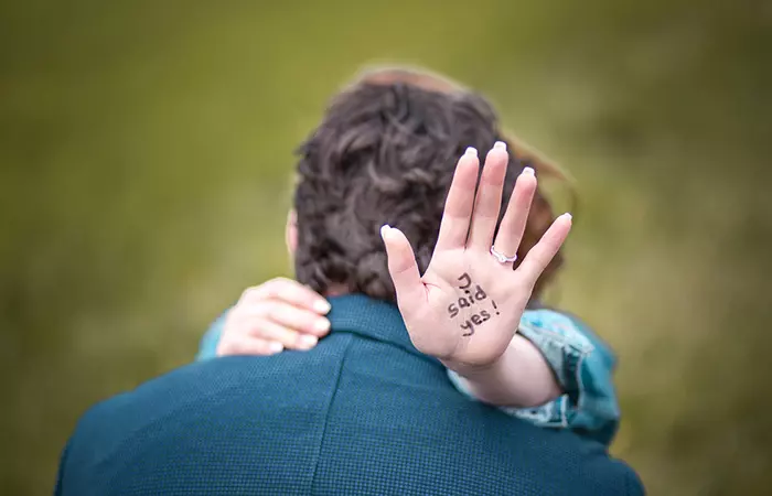 Couple hug after getting engaged