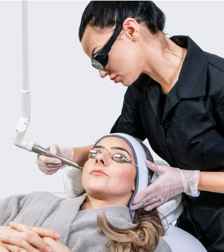 A woman having laser treatment for acne scars