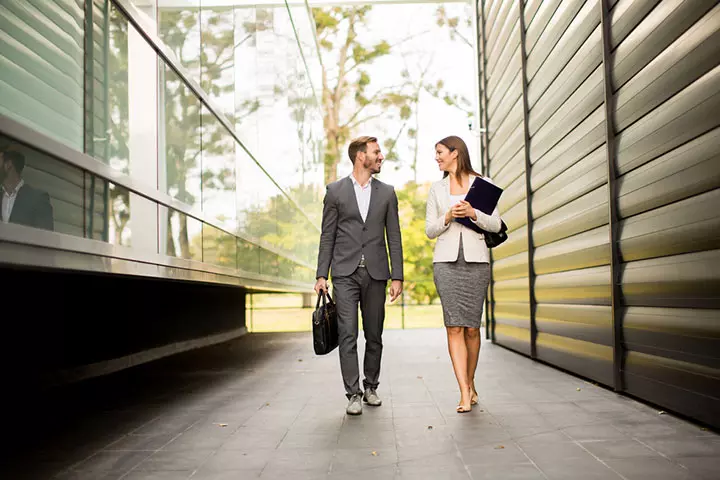 Young couple walking outside the office