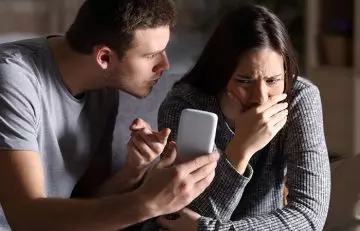 Boyfriend showing phone to his cheater girlfriend