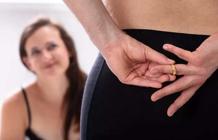 Man hiding his wedding ring