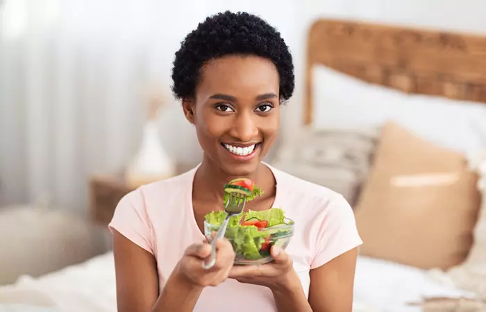 An African woman having a healthy balanced meal