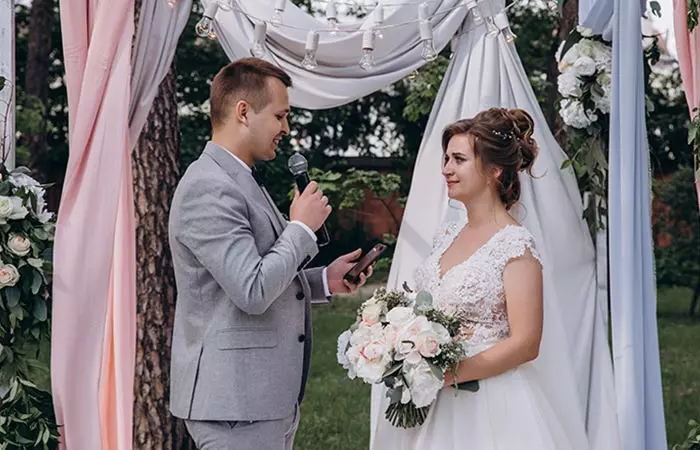 Groom making vows to bride on their wedding day