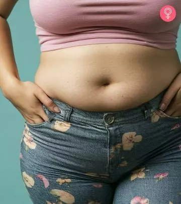 A girl showing her belly pooch