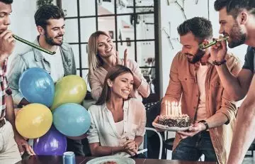 A group of friends celebrating a friend’s birthday