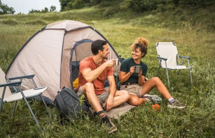 A happy couple camping together