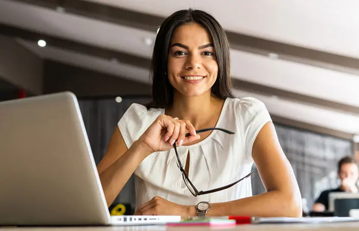 A smart Scorpio woman working on her laptop