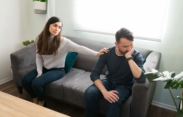 A woman saying sorry to her boyfriend