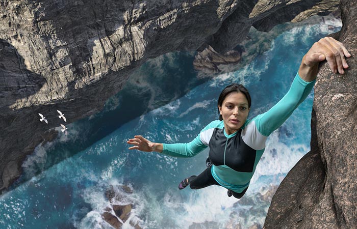 Courageous Scorpio woman rock climbing