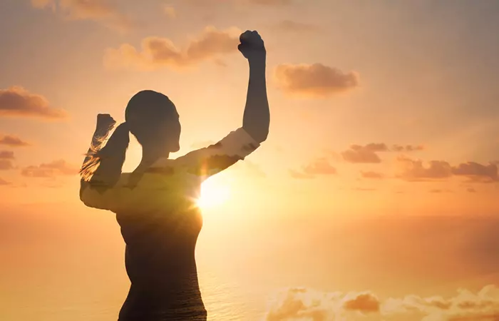 Determined Scorpio woman flexing arms