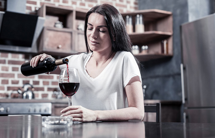 Woman finishing wine bottle may not feel bloated