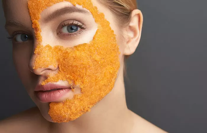 Close-up of a woman's face with yuzu mask on it