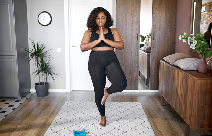 Woman doing yoga to reverse weight gain
